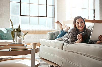 Buy stock photo Relax, online shopping and credit card, happy woman on sofa on ecommerce app with tablet and internet banking in home. Technology, cashback payment and girl on couch on retail website or digital shop