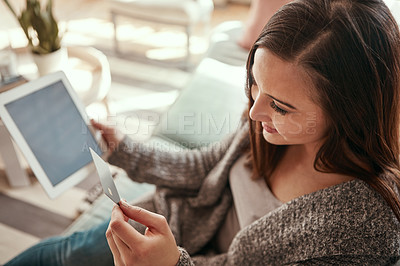 Buy stock photo Tablet screen, credit card and happy woman on sofa with bank, payment or online shopping sign up in a house. Digital, password or girl person in a living room with ecommerce, sale or retail discount