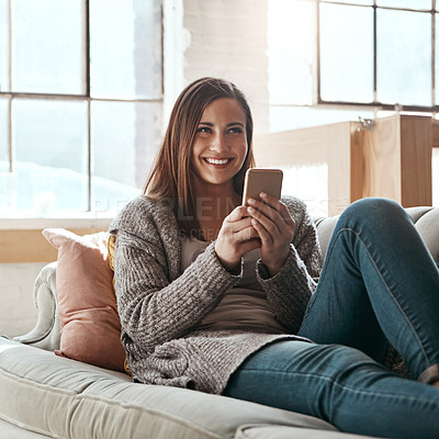 Buy stock photo Thinking, phone and woman relax on a sofa, happy and smile while chatting online in her home. Idea, girl and smartphone app for online dating, social media and streaming while resting in living room