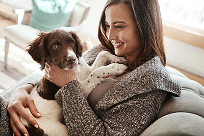 Buy stock photo Love, relaxing and woman with dog on sofa bonding with pet in living room at apartment. Smile, animal and happy female person cuddle, hug and embrace puppy with care on couch in lounge at home.