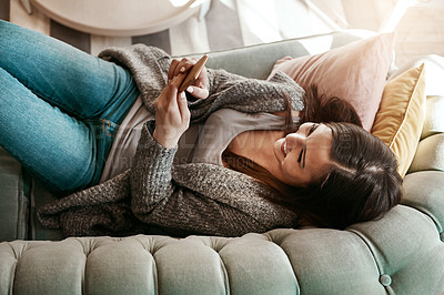 Buy stock photo Woman relax on sofa with phone, social media scroll and communication at home, contact and technology. Happy woman, smile for meme and web search with streaming, smartphone and rest on couch top view