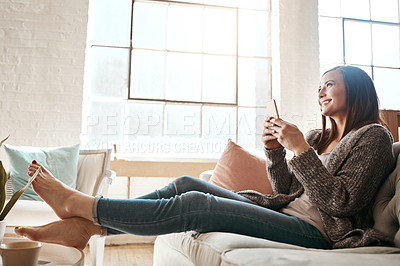 Buy stock photo Internet, phone and woman relax on a sofa with social media, texting and browsing in her home. Girl, smartphone and online chatting, app and online dating while streaming and resting in a living room