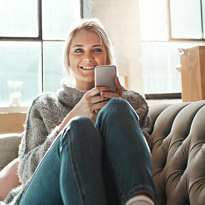 Buy stock photo Smile, woman and phone on a home sofa with lens flare and happiness in the sun on wifi. Mobile, social media scroll and mobile phone internet of a person on a house couch in a living room happy