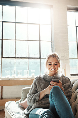 Buy stock photo Phone, smile and woman in home on sofa for social media, news and reading email. Smartphone, relax and happy girl in living room to scroll on app, blog and chat on mobile website on internet in house