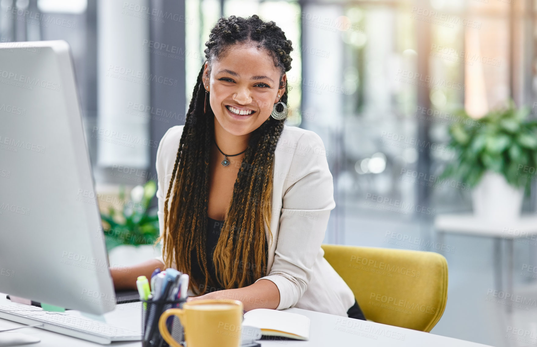 Buy stock photo Cropped portrait of an attractive young businesswoman sitting at her desk in the office