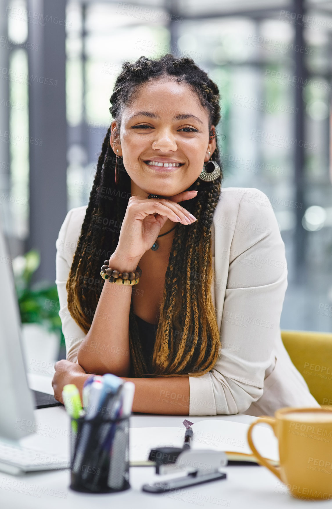 Buy stock photo Cropped portrait of an attractive young businesswoman sitting at her desk in the office