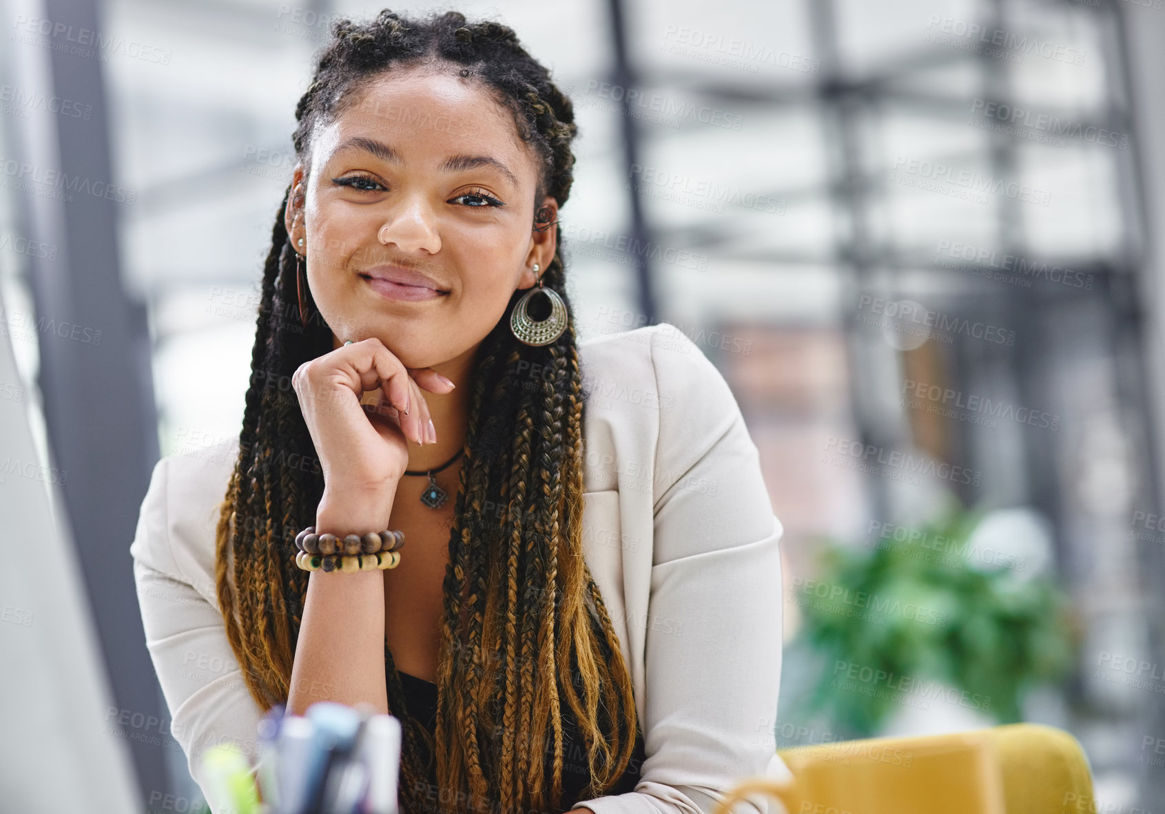 Buy stock photo Cropped portrait of an attractive young businesswoman sitting at her desk in the office