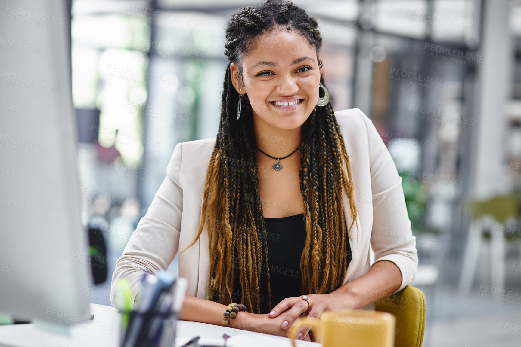 Buy stock photo Cropped portrait of an attractive young businesswoman sitting at her desk in the office