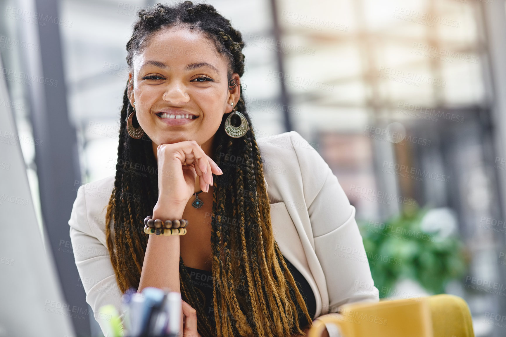 Buy stock photo Cropped portrait of an attractive young businesswoman sitting at her desk in the office