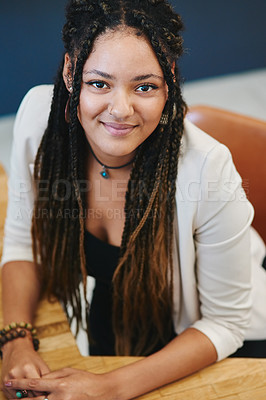 Buy stock photo Cropped portrait of an attractive young woman sitting in her home office