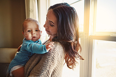 Buy stock photo Shot of a mother bonding with her baby boy at home