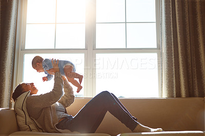 Buy stock photo Happy, mother and baby on sofa playing on weekend for love, bonding and relationship development in home. Care, woman and child together on couch in summer for safety, support in living room