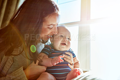 Buy stock photo Shot of a mother bonding with her baby boy at home