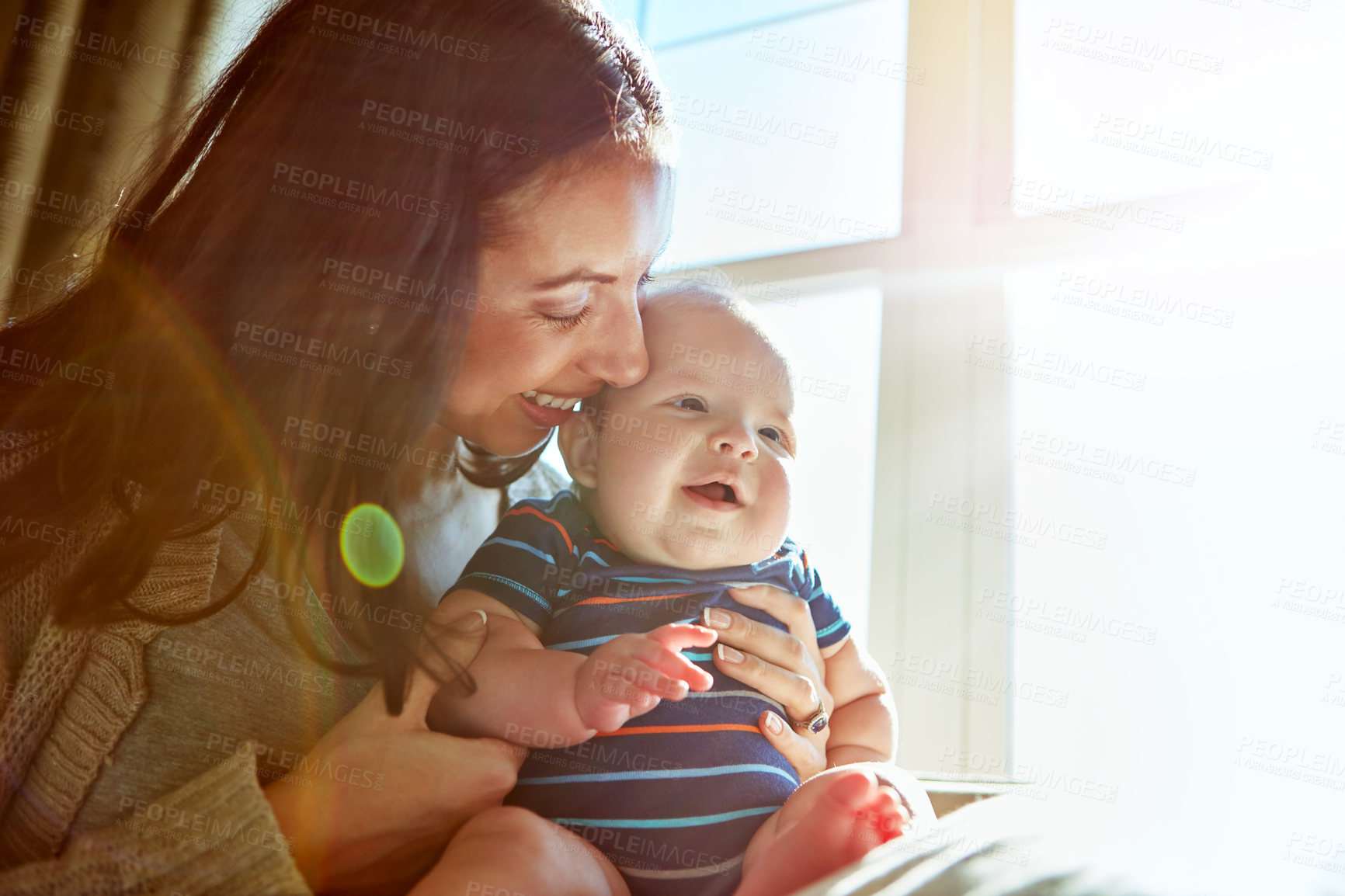 Buy stock photo Shot of a mother bonding with her baby boy at home