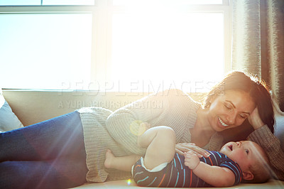 Buy stock photo Happy, mother and baby on sofa relax on weekend for love, bonding and relationship development in home. Care, woman and child together on couch in summer for safety, support or playing in living room