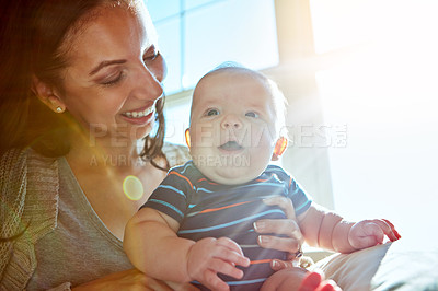 Buy stock photo Mother, baby and bonding in living room on sofa with love for relationship with new born, care and embrace. Closeup, sunshine and relax with smile, happiness and playing on couch with light.