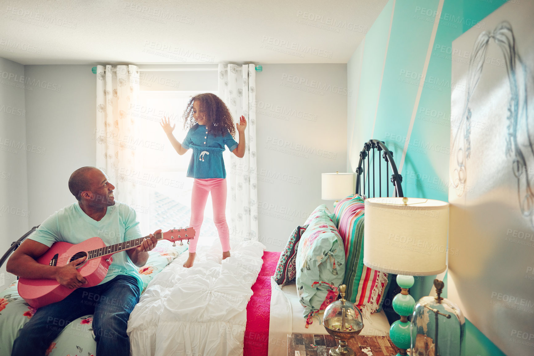 Buy stock photo Child, father and guitar on bed at home for playing, having fun or bonding together with concert. House, musical instrument or entertainment with dad musician with skills, sound and girl jumping