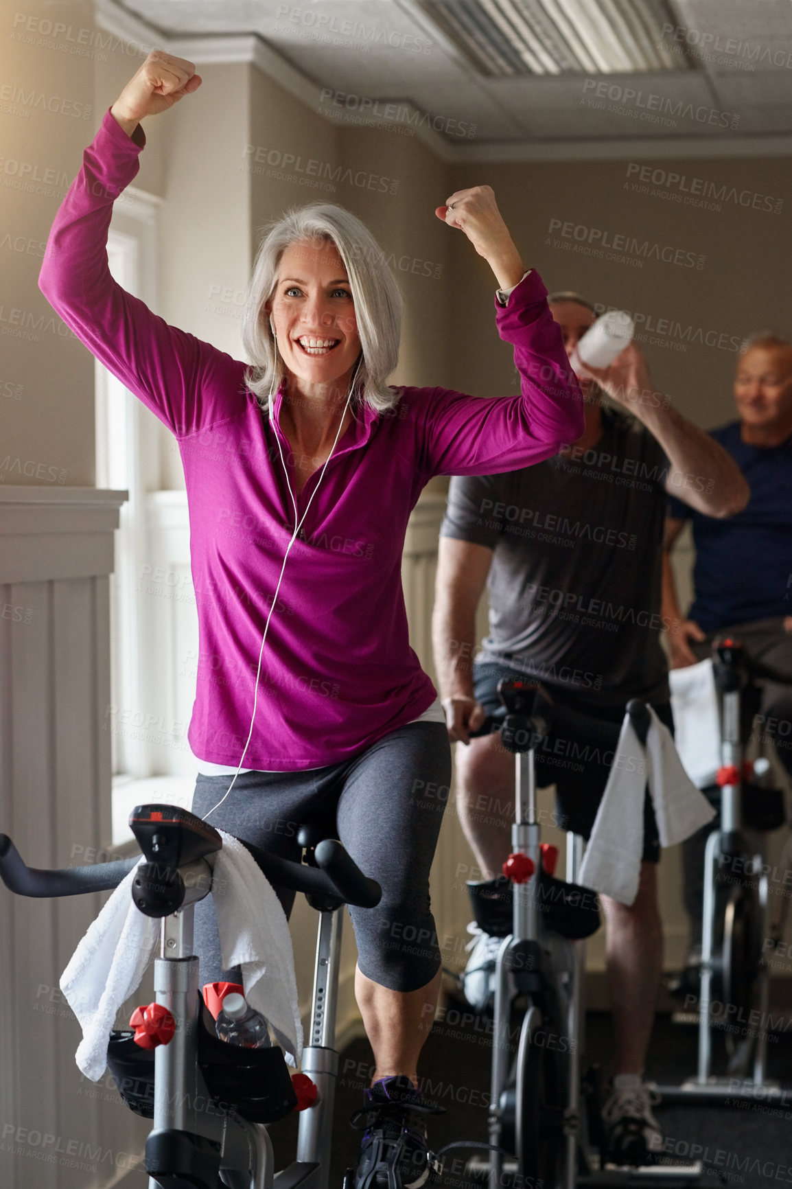 Buy stock photo Spinning class, success or happy woman on bicycle in workout or training for cycling progress, health or wellness. Gym, winner or excited senior person on bike machine for fitness, exercise and goal