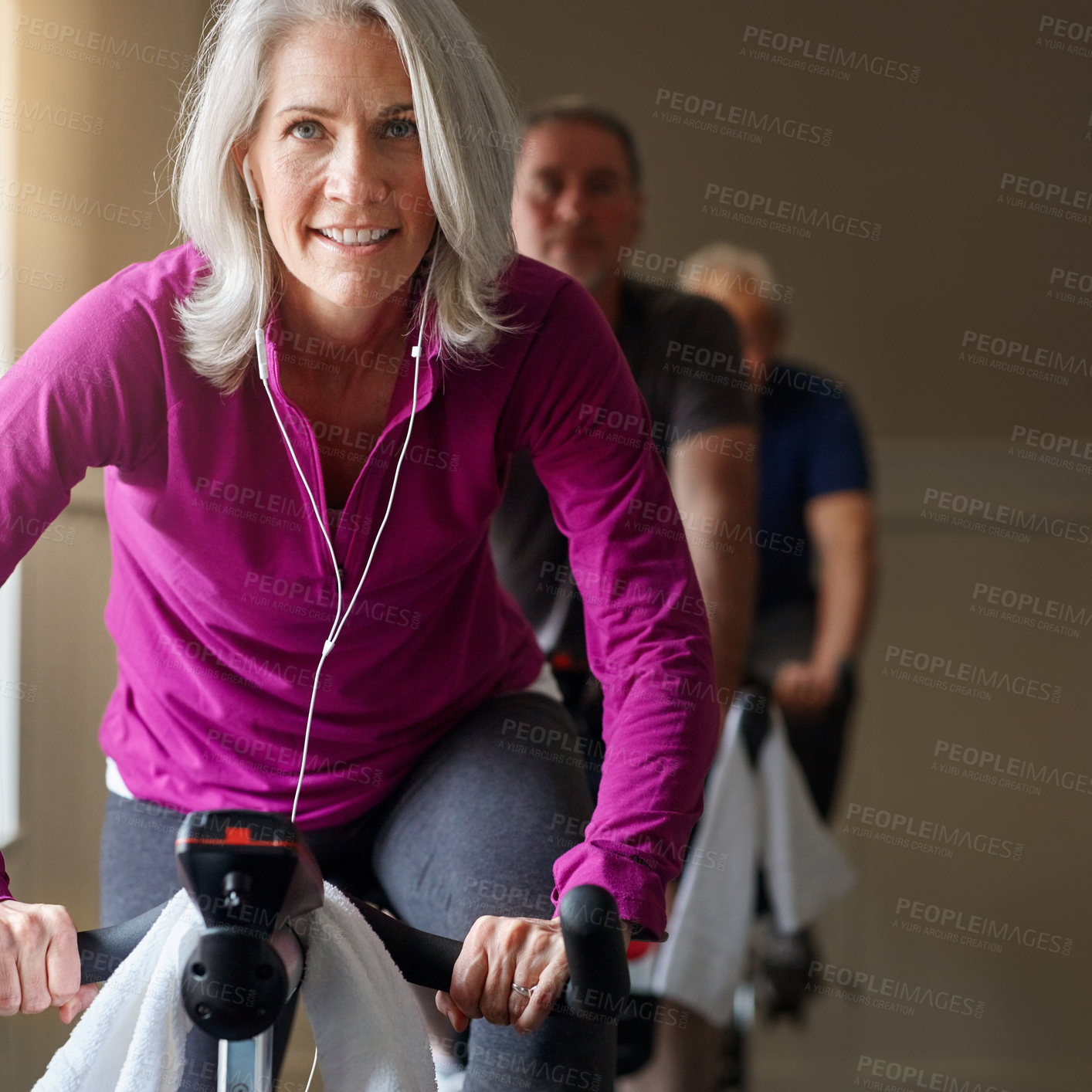 Buy stock photo Senior, portrait or happy woman in spinning class in workout or training for cycling bike, health or wellness. Proud, exercise or elderly sports person on gym bicycle for fitness, challenge or energy