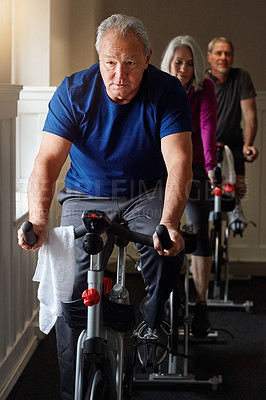 Buy stock photo Spin class, mature or man on cycling bike in workout or cardio training for energy, health or wellness. Active, performance or sports person on bicycle machine for fitness, gym challenge or exercise