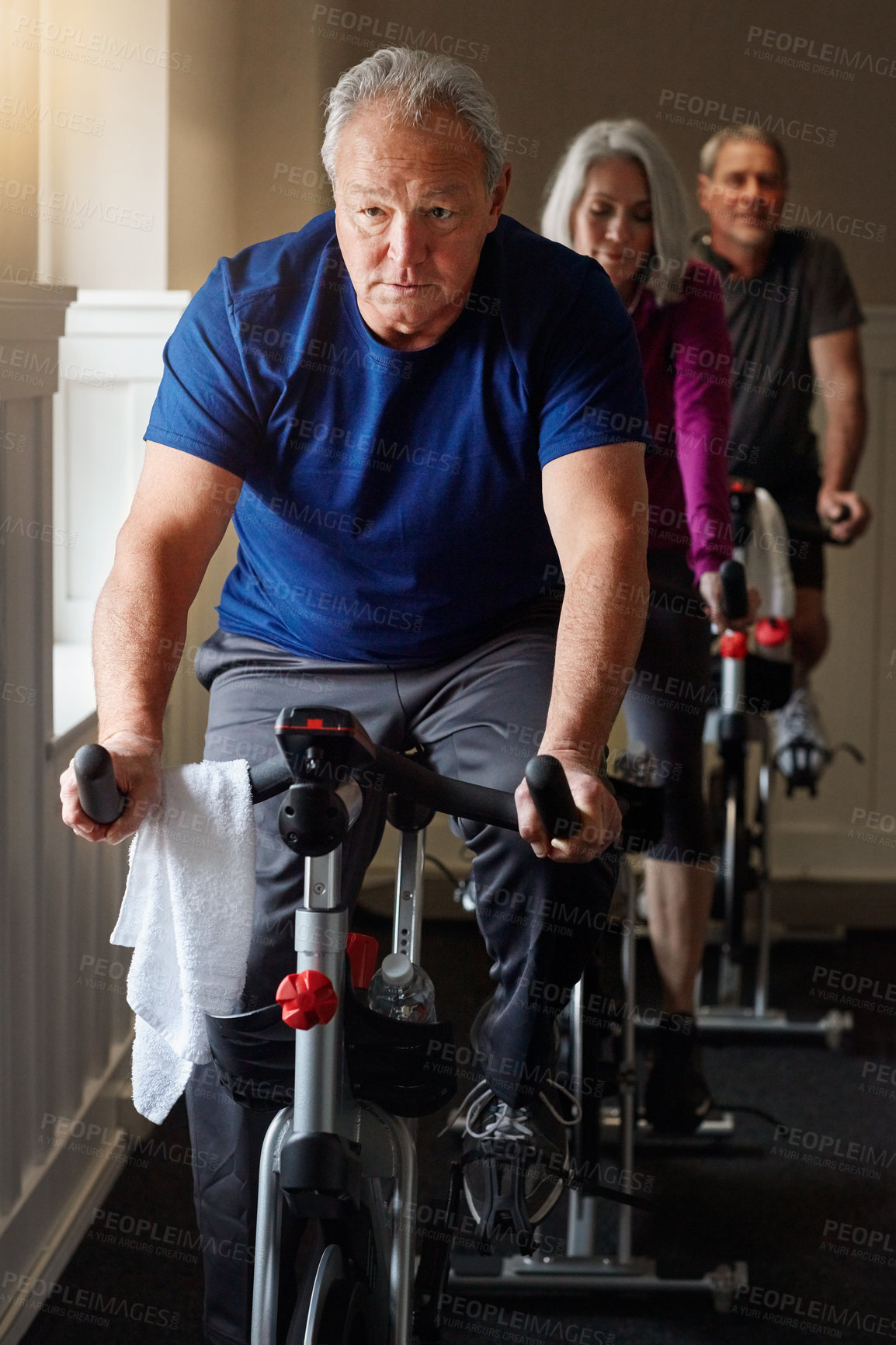 Buy stock photo Spin class, mature or man on cycling bike in workout or cardio training for energy, health or wellness. Active, performance or sports person on bicycle machine for fitness, gym challenge or exercise