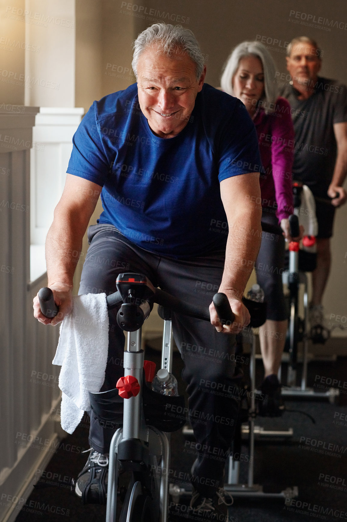 Buy stock photo Exercise, cycling and senior man in gym for spinning class, training and fitness with physical activity. Workout club, people and team on bike machine for health, wellness and endurance with cardio