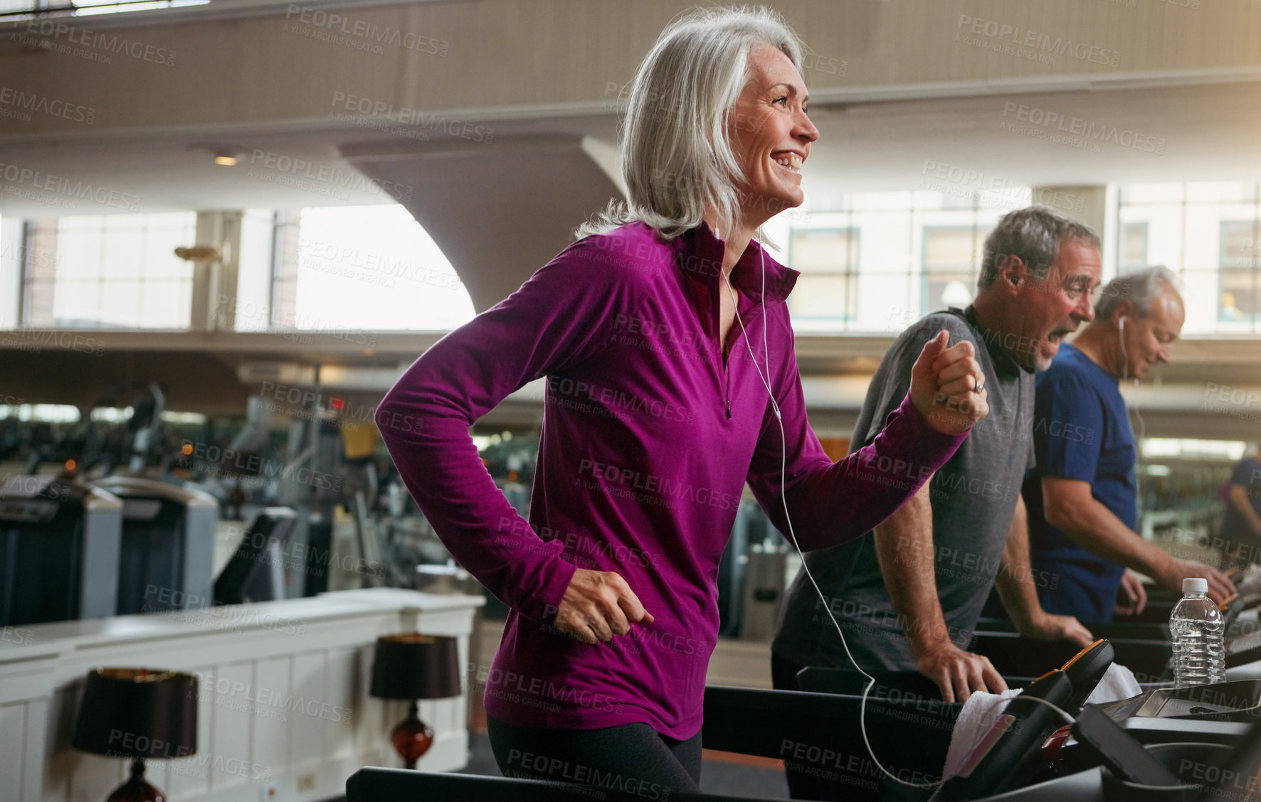 Buy stock photo Workout, running and mature woman on treadmill in gym for health, wellness and body exercise. Smile, athletes and people on cardio equipment for endurance or fitness training in sports center