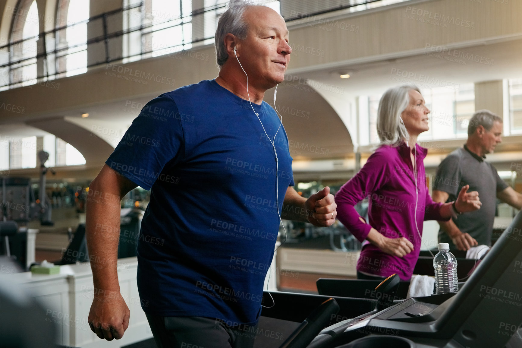 Buy stock photo Happy, senior people and running on treadmill for wellness, exercise, and fitness in retirement. Men, woman and friends training in gym for cardio workout, physical vitality and body strength