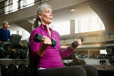 Buy stock photo Senior fitness, dumbbell or old woman at gym for training, wellness or cardio with earphones, music or exercise. Weightlifting, bodybuilding and elderly female person at sports center for arm workout