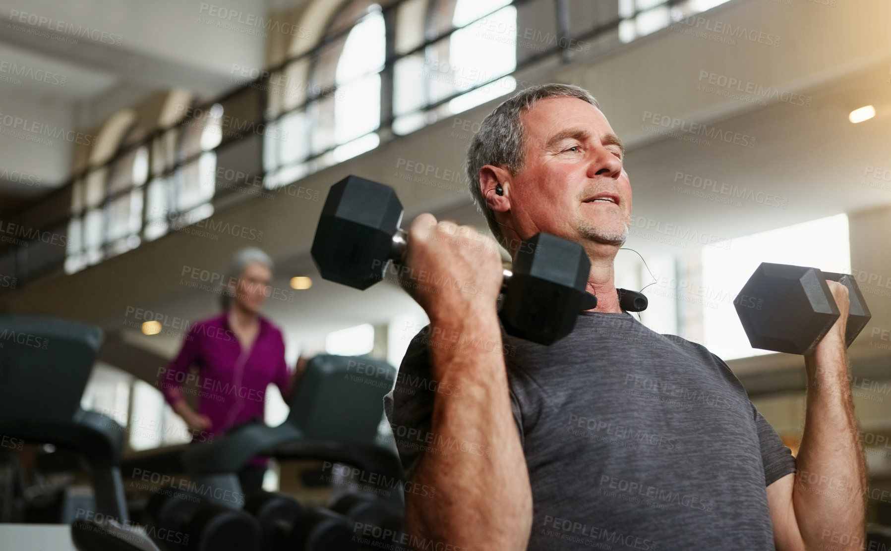 Buy stock photo Senior fitness, gym and old man with dumbbells for weightlifting, challenge or  workout, training or bodybuilding. Biceps, arms and elderly person with hand weight for strength, mindset or exercise