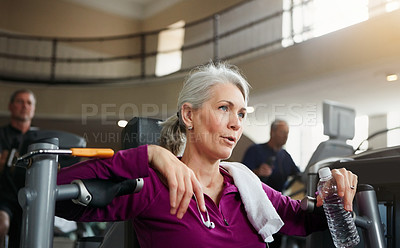 Buy stock photo Portrait of a senior woman having a rest during her workout at the gym