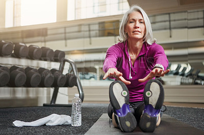 Buy stock photo Portrait of a mature woman working out at the gym