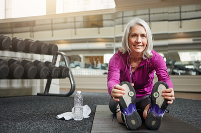 Buy stock photo Mature woman, stretching and legs on gym floor, warm up and challenge with vision for workout. Person, muscle and start training for wellness with development, ready and exercise mat at fitness club