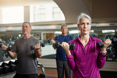 Buy stock photo Senior fitness club, people and dumbbells at gym for training, health and wellness, sport or exercise. Class, workout and elderly group of friends at a studio for hand weight, cardio or weightlifting