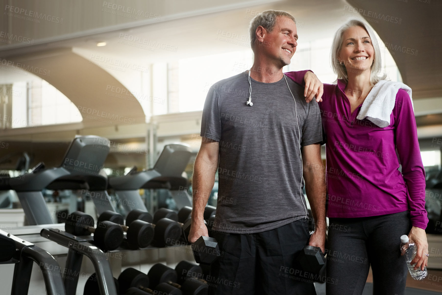 Buy stock photo Senior couple, happy and break at gym, bottle and dumbbell for training, memory and exercise for health. Man, woman and smile together for support, workout and motivation with water at wellness club