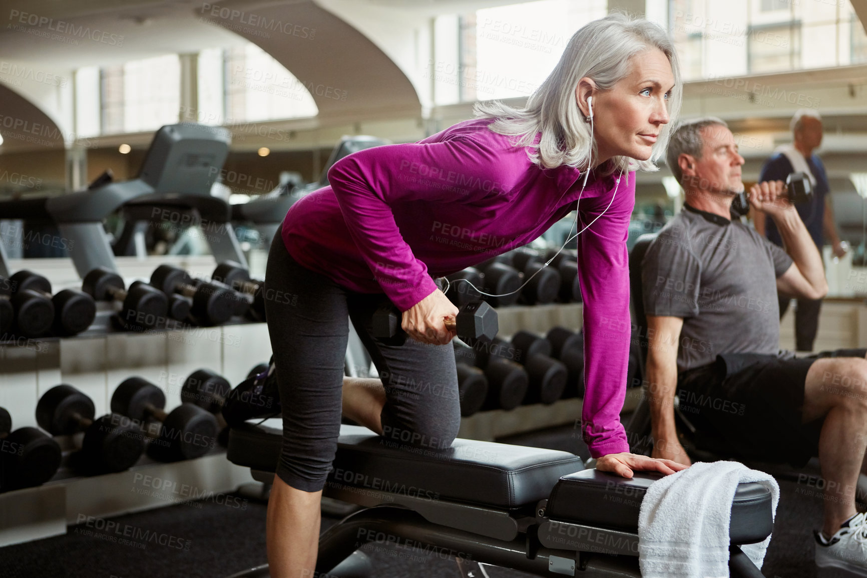 Buy stock photo Shot of a senior group of people working out together at the gym