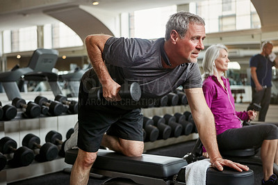 Buy stock photo Shot of senior group of people working out together at the gym
