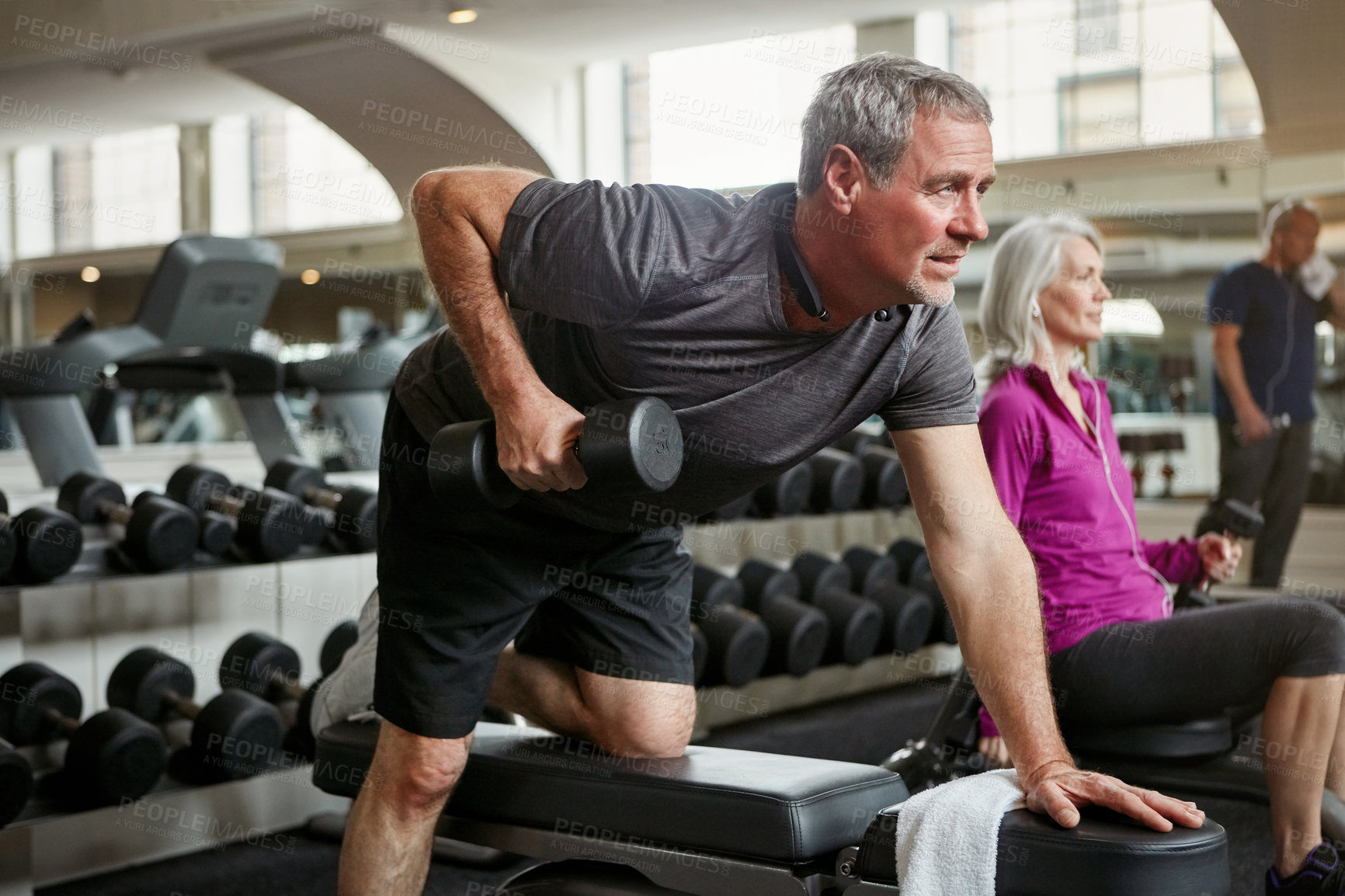 Buy stock photo Shot of senior group of people working out together at the gym