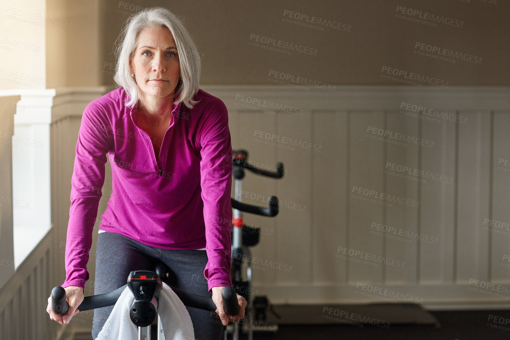 Buy stock photo Senior, portrait or woman on cycling bike in workout or cardio training for endurance, health or wellness. Gym, exercise or sports person on bicycle machine for fitness, challenge and energy