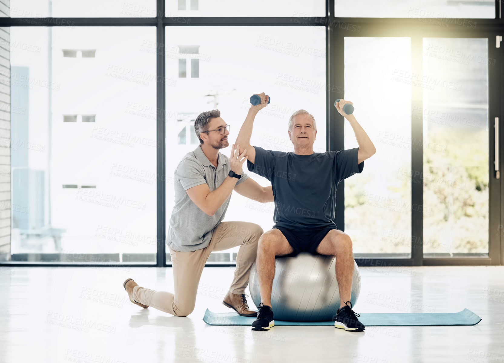 Buy stock photo Healthcare, physiotherapy and old man with dumbbells, gym ball and rehabilitation in senior care. Physiotherapist, consultant and elderly patient in mobility training, exercise and help in retirement