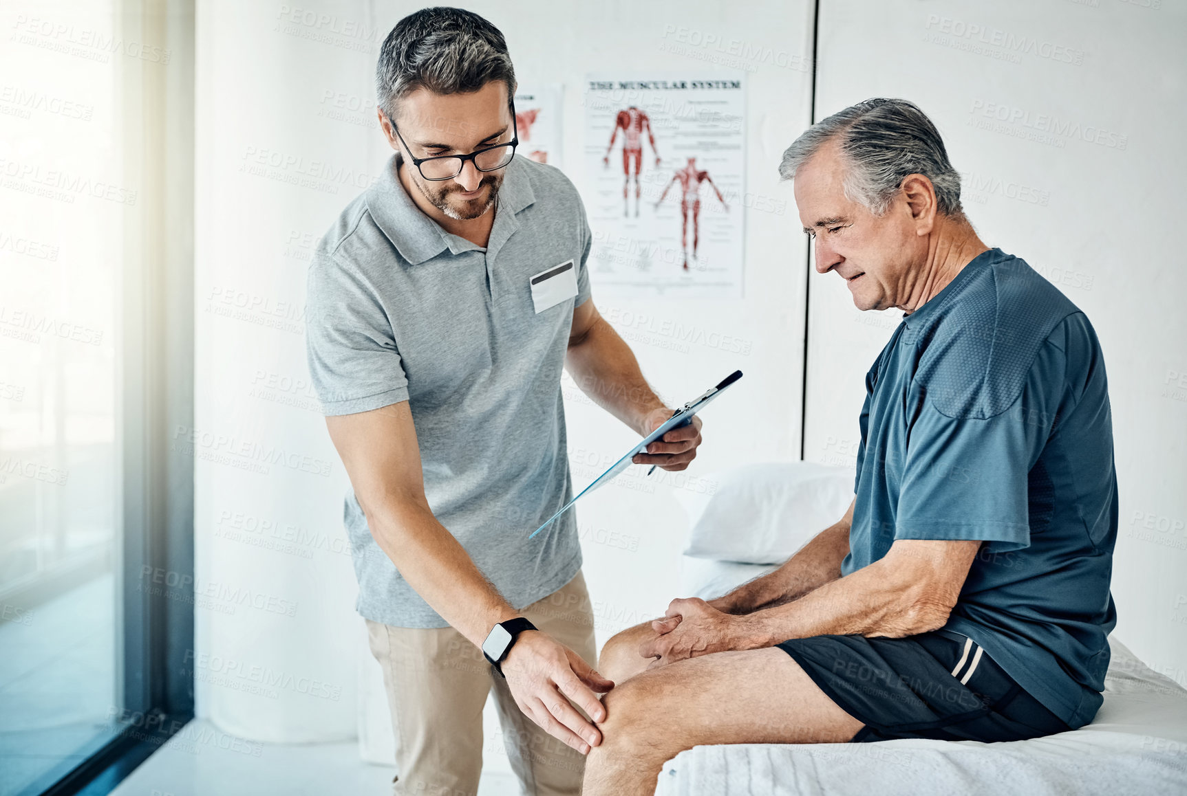 Buy stock photo Shot of a caring physiotherapist consulting with his mature patient in the rehabilitation center