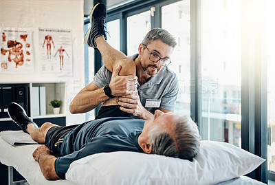 Buy stock photo Stretching legs, help and a physiotherapist with a man for wellness and recovery support. Rehabilitation, health and a male doctor helping an elderly person with physiotherapy on body muscle