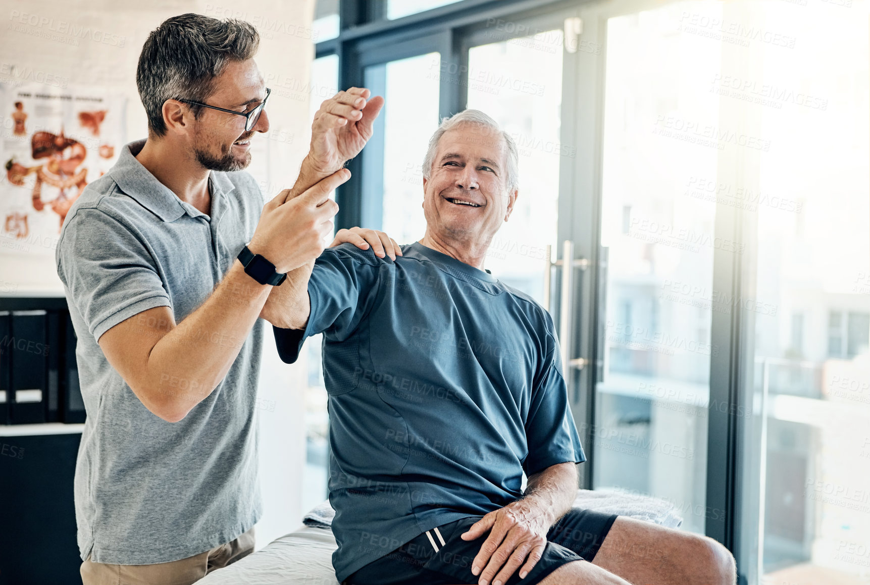 Buy stock photo Physiotherapy, chiropractor and happy old man with arm pain for rehabilitation, consulting and exercise. Healthcare, physical therapy and person with patient for medical service, wellness and support