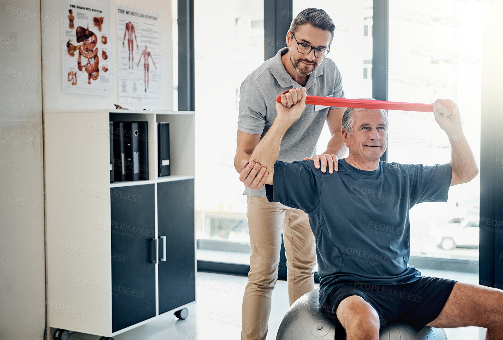 Buy stock photo Help, physiotherapy and old man with resistance band, stretching and clinic for senior healthcare. Physio, therapist and elderly patient for mobility training, exercise and support in retirement.