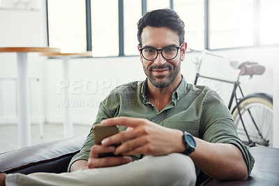 Buy stock photo Creative businessman, phone and smile for social media, communication or advertising at office. Portrait of happy employee man smiling with smartphone in networking or online conversation for startup