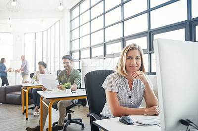 Buy stock photo Portrait of a young designer in an office with her colleagues in the background