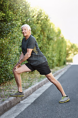 Buy stock photo Portrait of a senior man warming up before a run outside