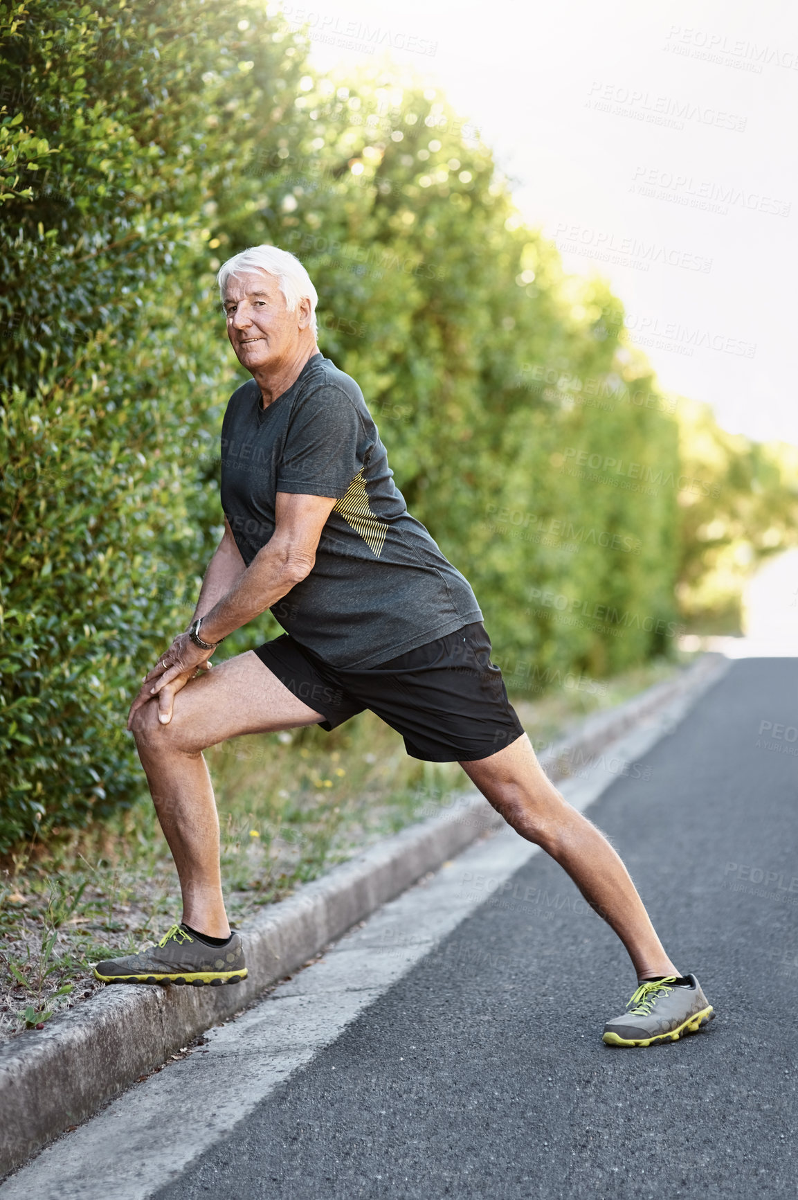 Buy stock photo Portrait, old man and stretching legs for fitness ready for workout, exercise or training in nature. Senior person, warm up and prepare for physical activity, running or cardio outdoor with smile