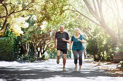 Buy stock photo Shot of a senior couple out for a run together