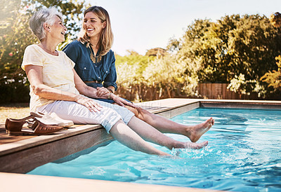 Buy stock photo Women relax together by swimming pool, love and care, quality time during summer vacation. Elderly mother, daughter and vacation, content outdoor with pool and wellness lifestyle with happy family